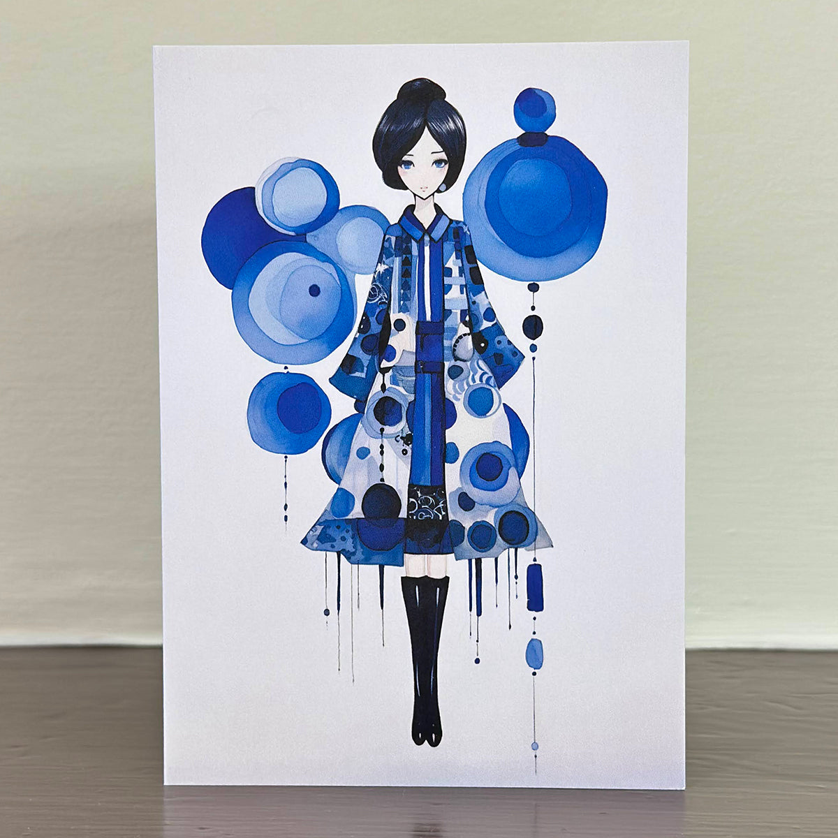 A Sweet Seasons greetings card, featuring a charming image of a girl in blue